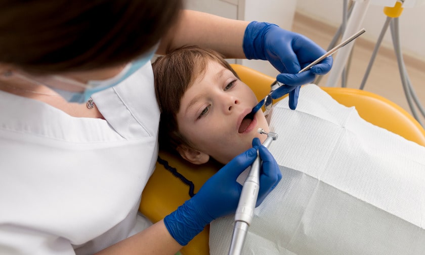 When ought I to bring my kid to an orthodontist?